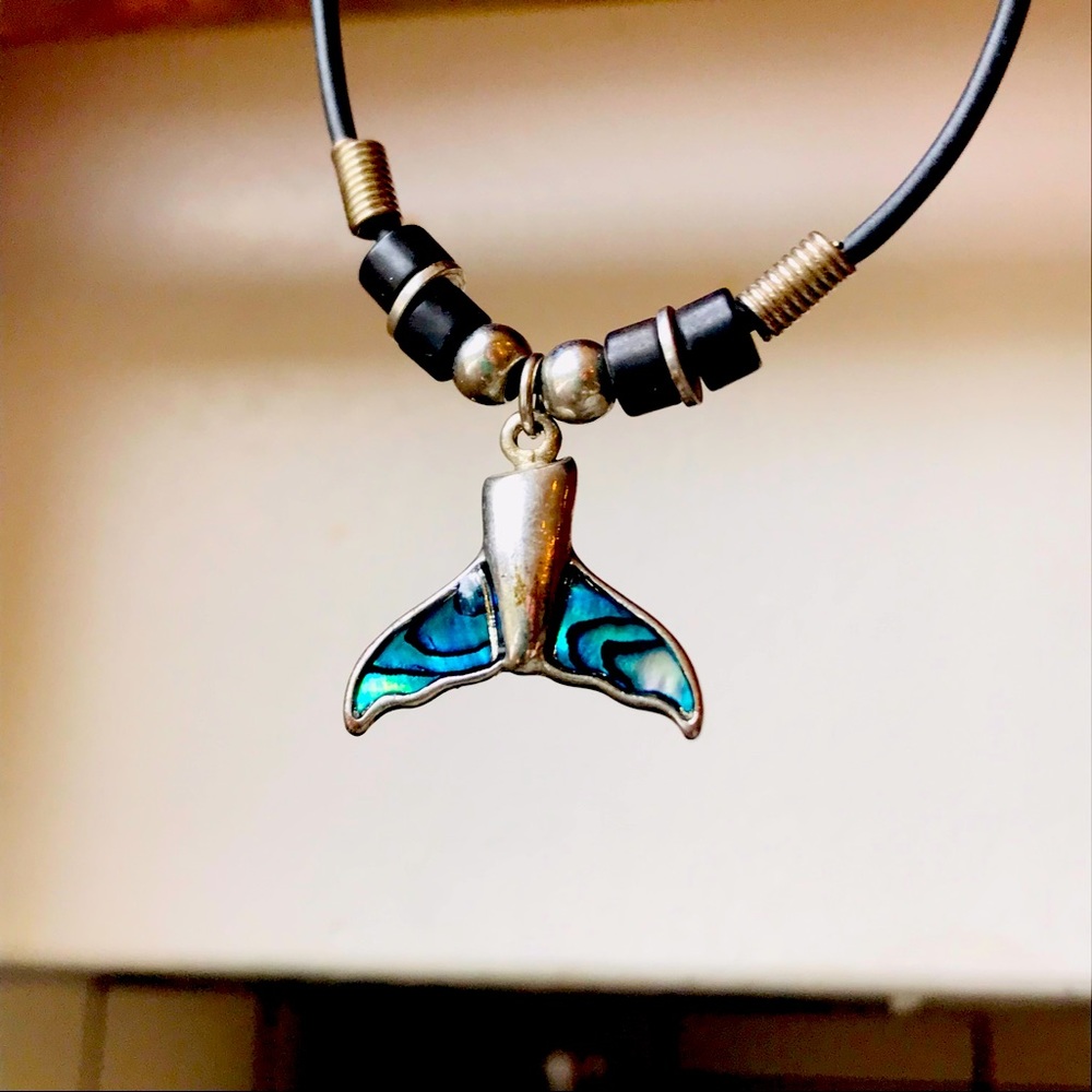 Dolphin Fin necklace with blue abalone accents and silver colored metal. Unisex